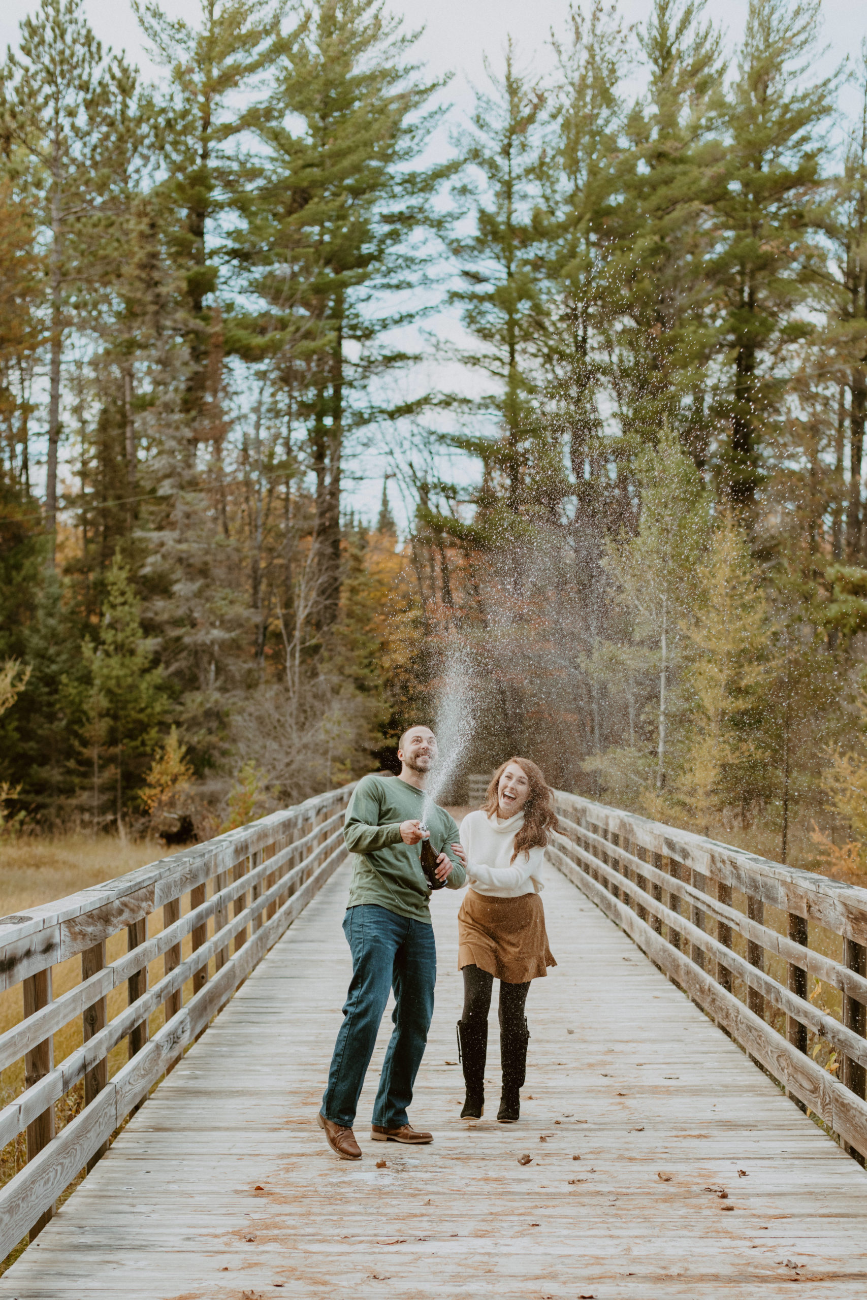 champagne-spray-during-eagle-river-engagement-session