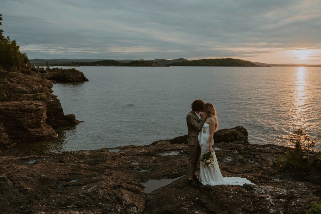 bride and groom on cliffs