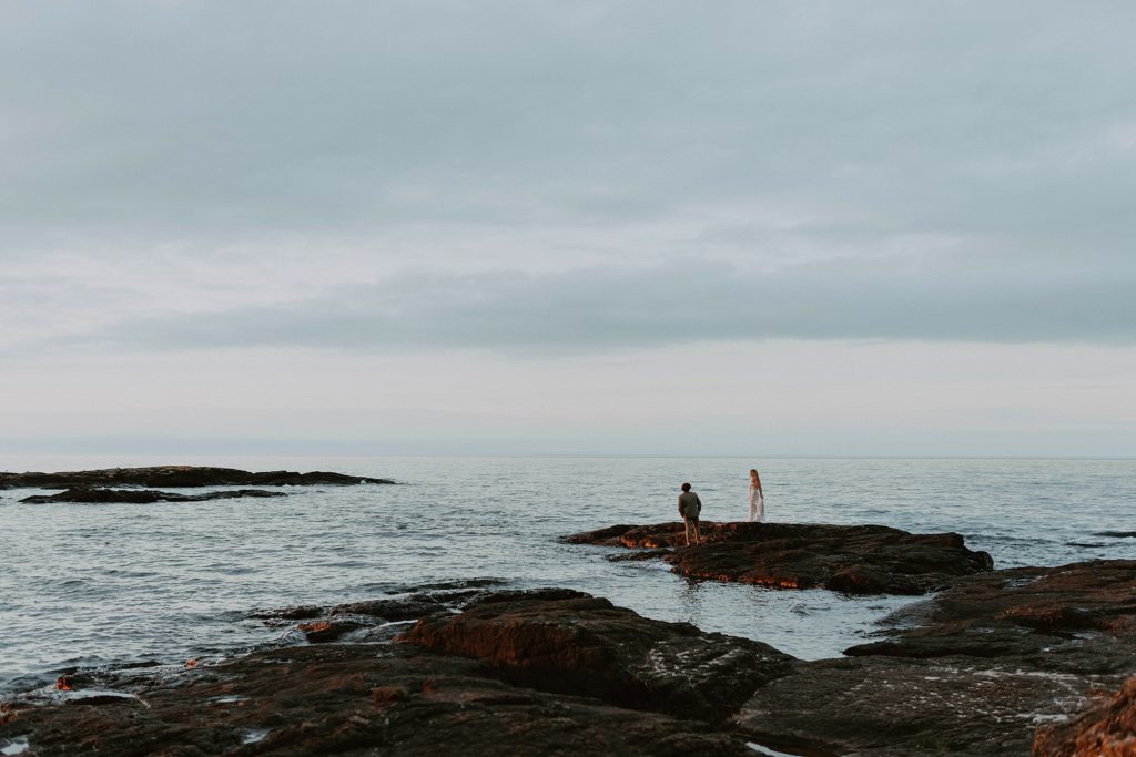 couple standing over ocean