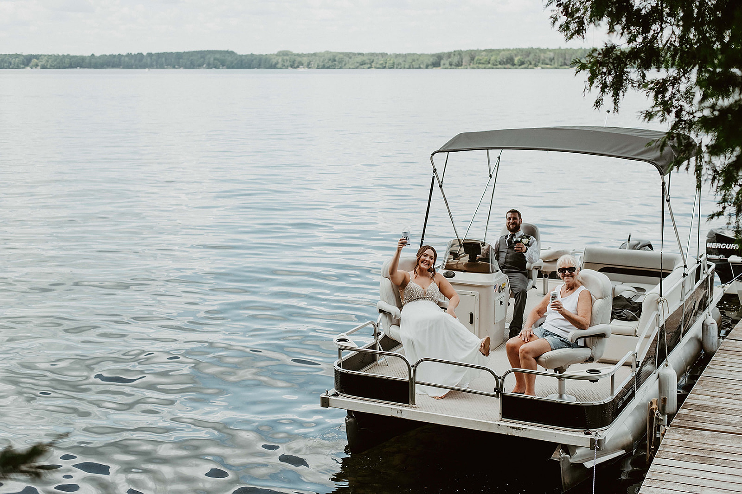 bride and groom on boat at big bay state park 