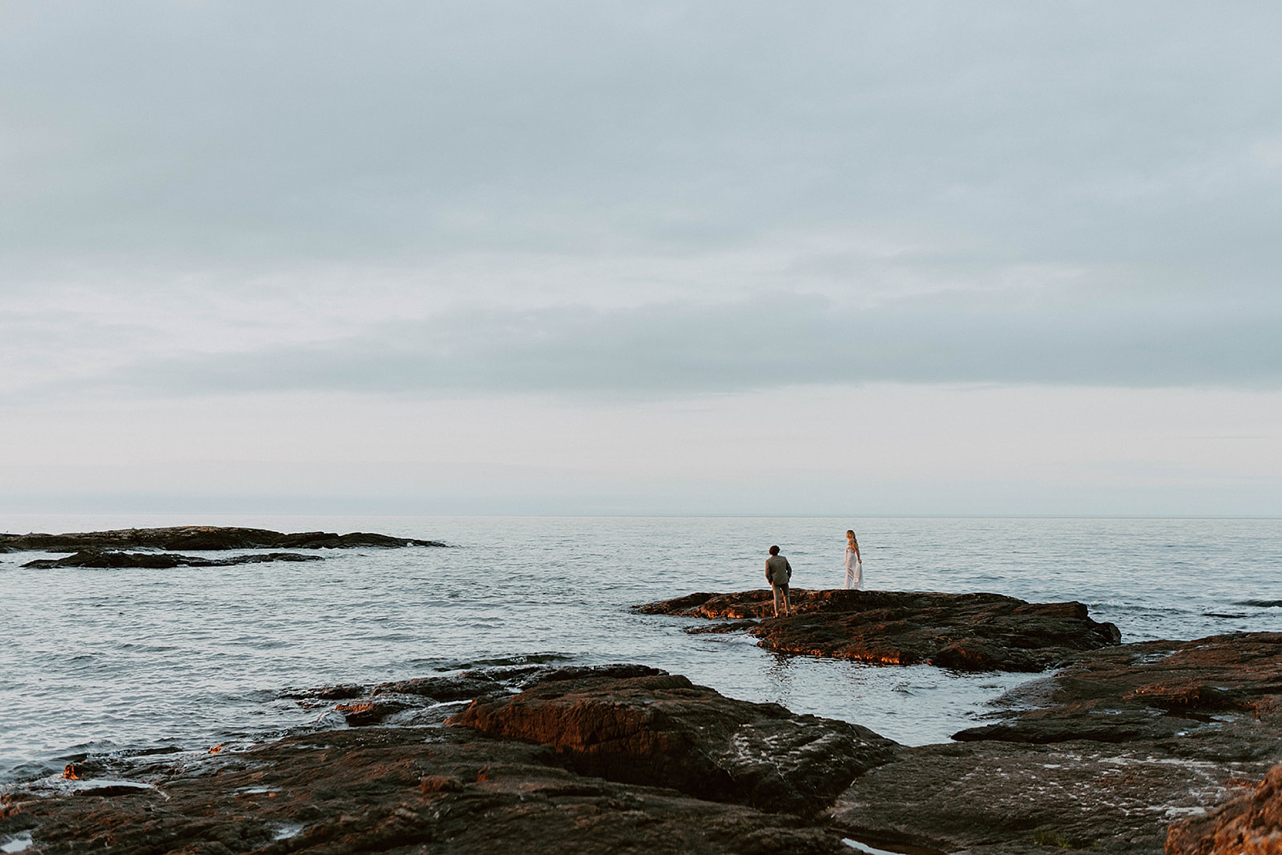 couple overlooking water in marquette 
